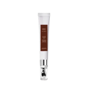 A white tube of "Correct/Protect Alchemist Cellular Repair Eye Cream" with metallic accents against a black background, showcasing skincare packaging design.