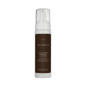 A white pump bottle labeled "ALCHMST Clear Pore Foaming Cleanser," featuring glycolic acid, salicylic acid, green tea extract, zinc, and copper PCA.