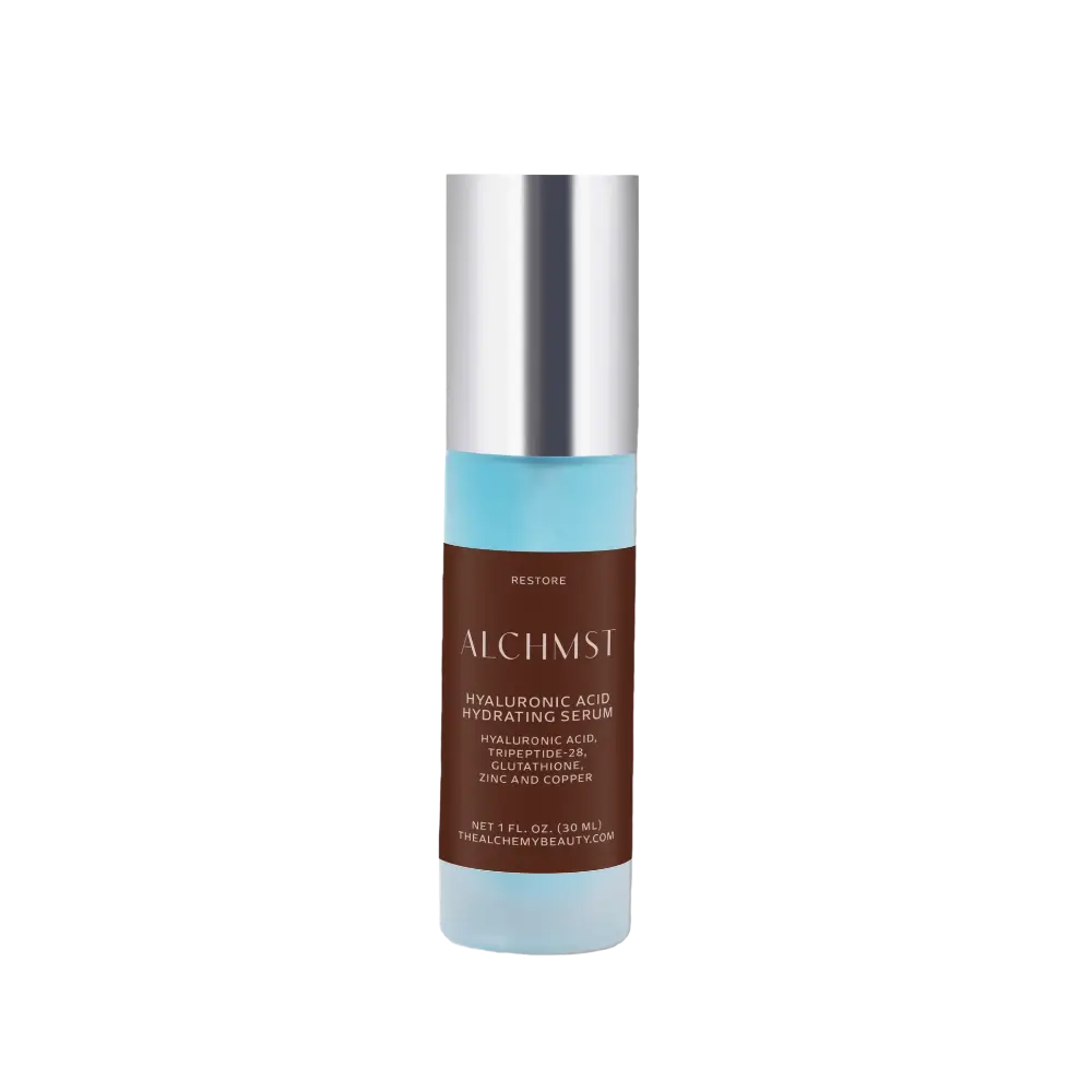 A cylindrical bottle labeled "ALCHMST Hyaluronic Acid Hydrating Serum" with a silver cap, featuring a brown and blue design.