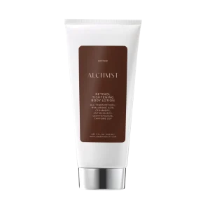 A white tube labeled "ALCHMST Retinol Tightening Body Lotion" with brown accents, containing retinol, hyaluronic acid, ceramides, and antioxidants.