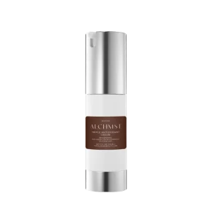 Sleek white and silver bottle labeled "ALCHMST Triple Antioxidant Cream," featuring resveratrol and polyphenols, against a plain black background.